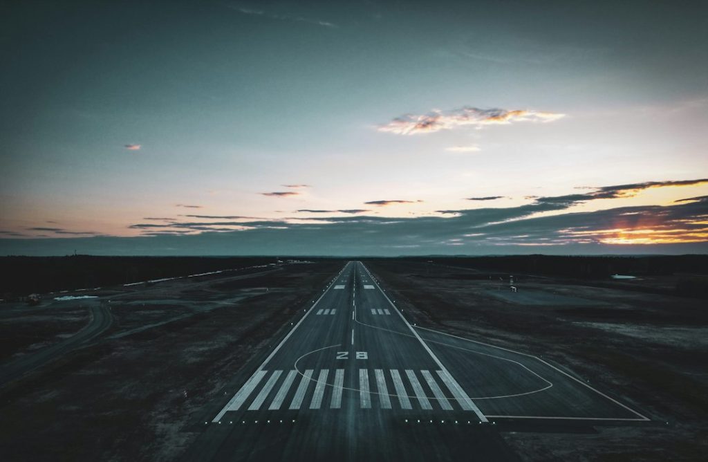 Airport runway markings at dusk